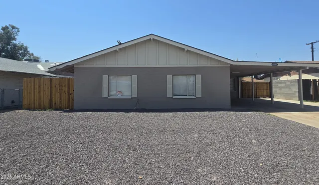 a house with trees in the background
