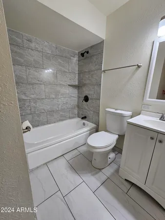 a bathroom with a toilet a sink and a bathtub