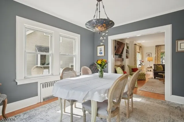 a view of a dining room with furniture and window