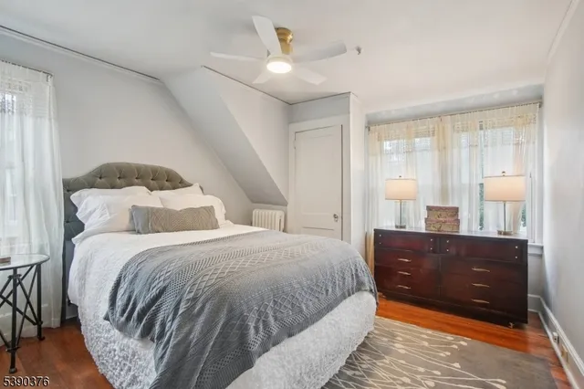 a bed room with a bed and a large window