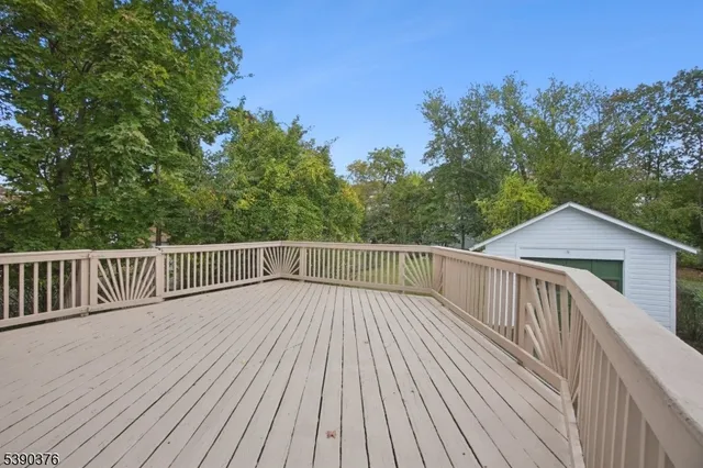 a view of deck with wooden floor and fence