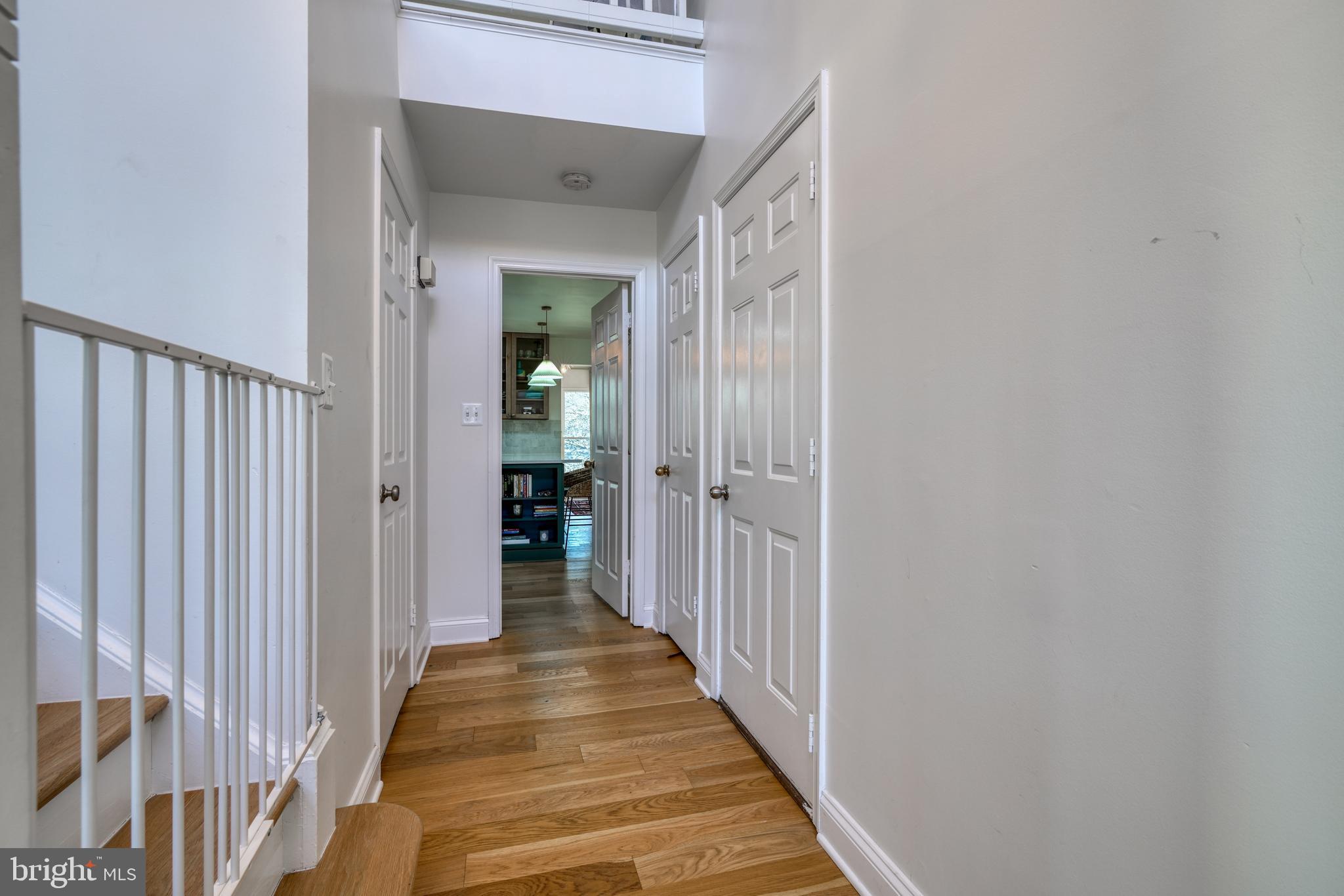 14235 Masterpiece Lane North Potomac, MD 20878 - Photo 11 of 66 a view of a hallway with a wooden door