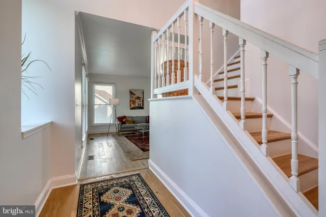 a living room with furniture and a rug