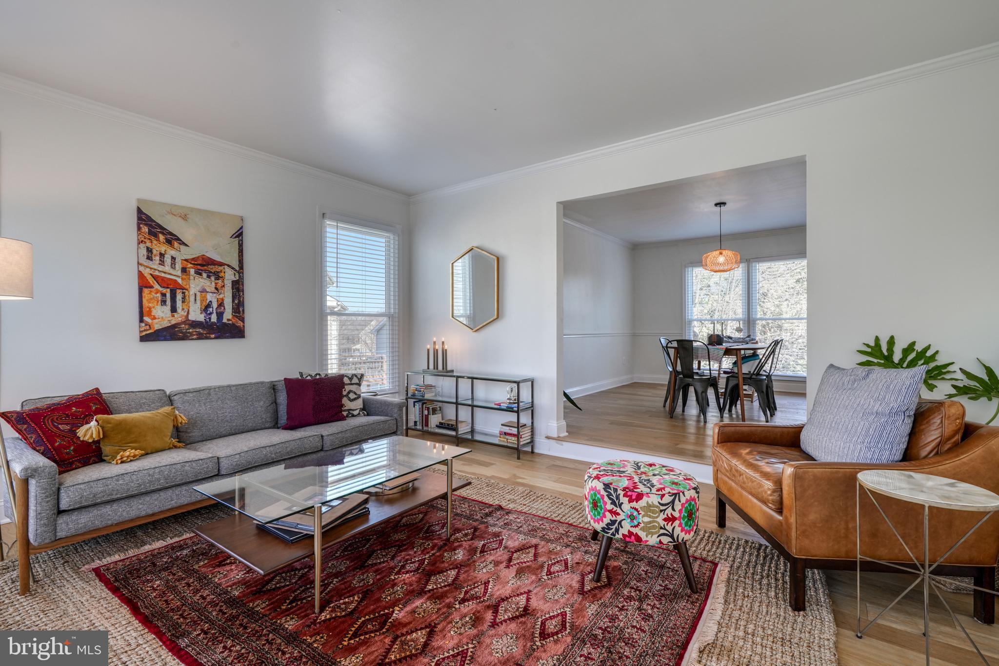 14235 Masterpiece Lane North Potomac, MD 20878 - Photo 14 of 66 a living room with furniture a rug and a painting on the wall