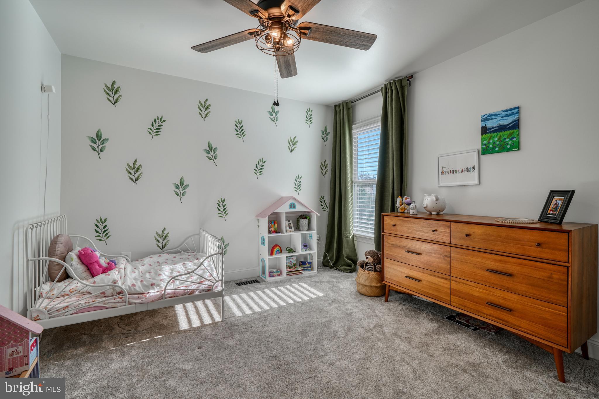 14235 Masterpiece Lane North Potomac, MD 20878 - Photo 29 of 66 a bedroom with a bed and a chandelier fan