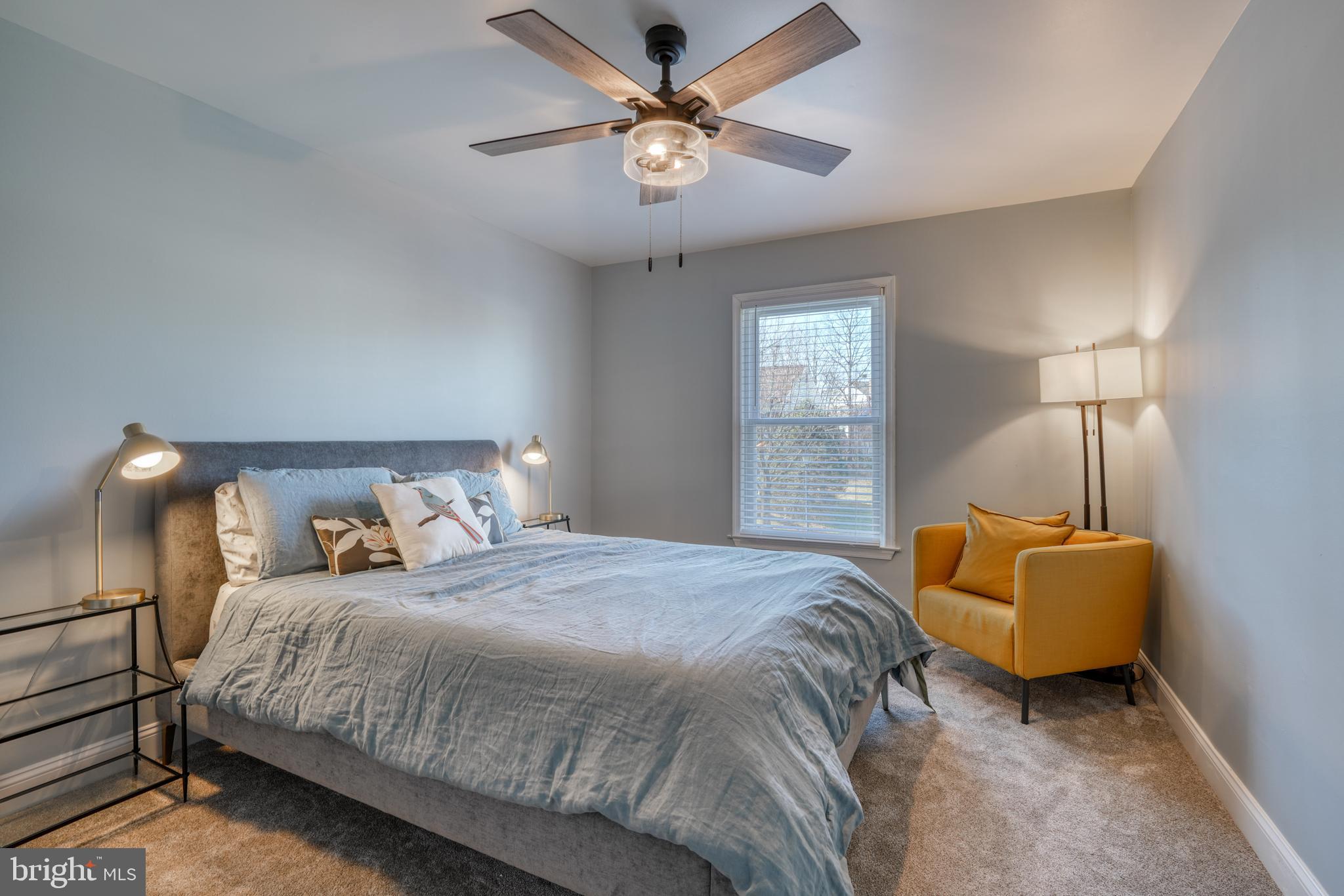 14235 Masterpiece Lane North Potomac, MD 20878 - Photo 31 of 66 a bedroom with a bed and a chandelier