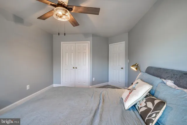 a bedroom with furniture and a fireplace