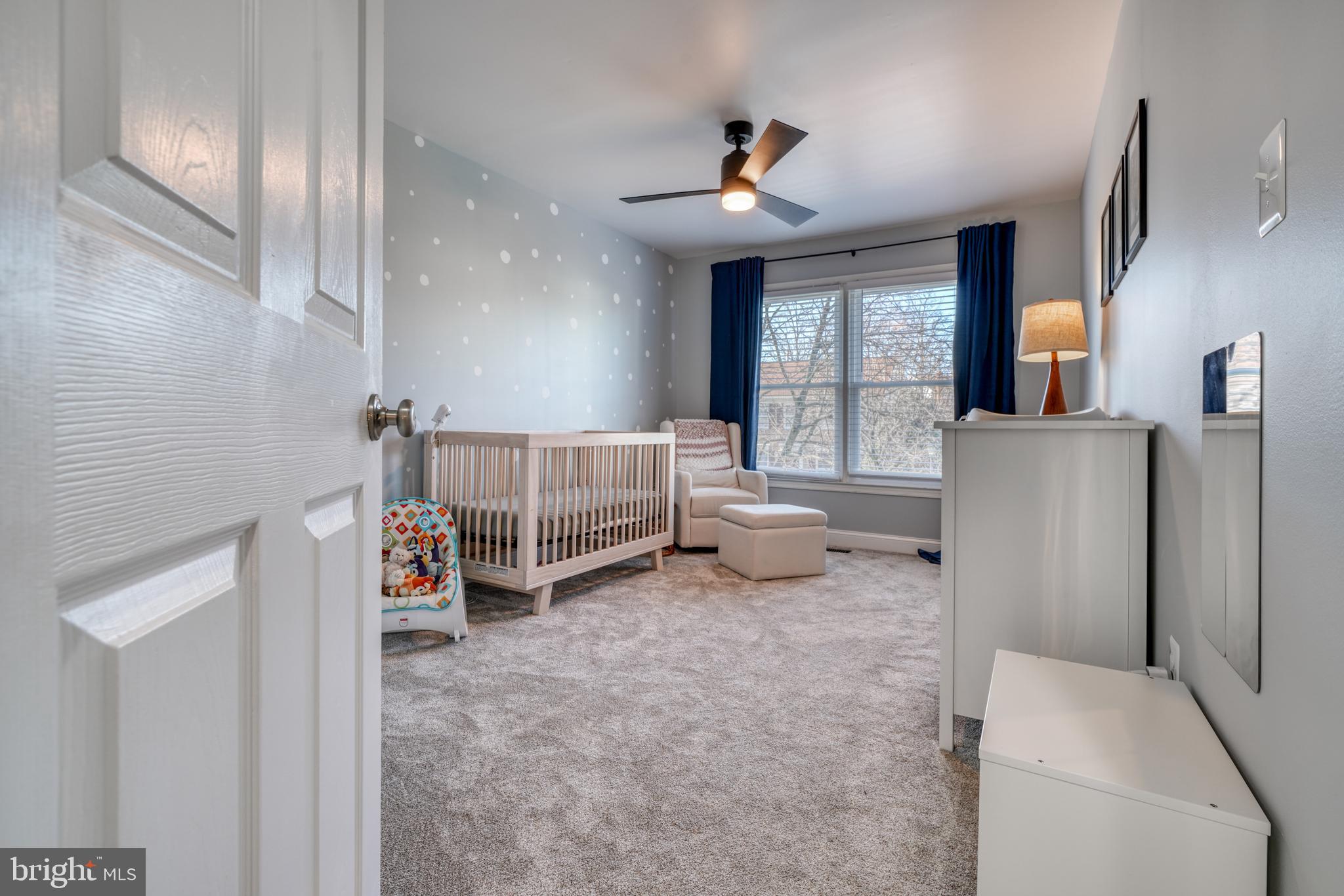 14235 Masterpiece Lane North Potomac, MD 20878 - Photo 33 of 66 a living room with furniture and a chandelier