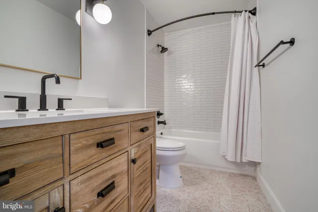 a bathroom with a bathtub and shower