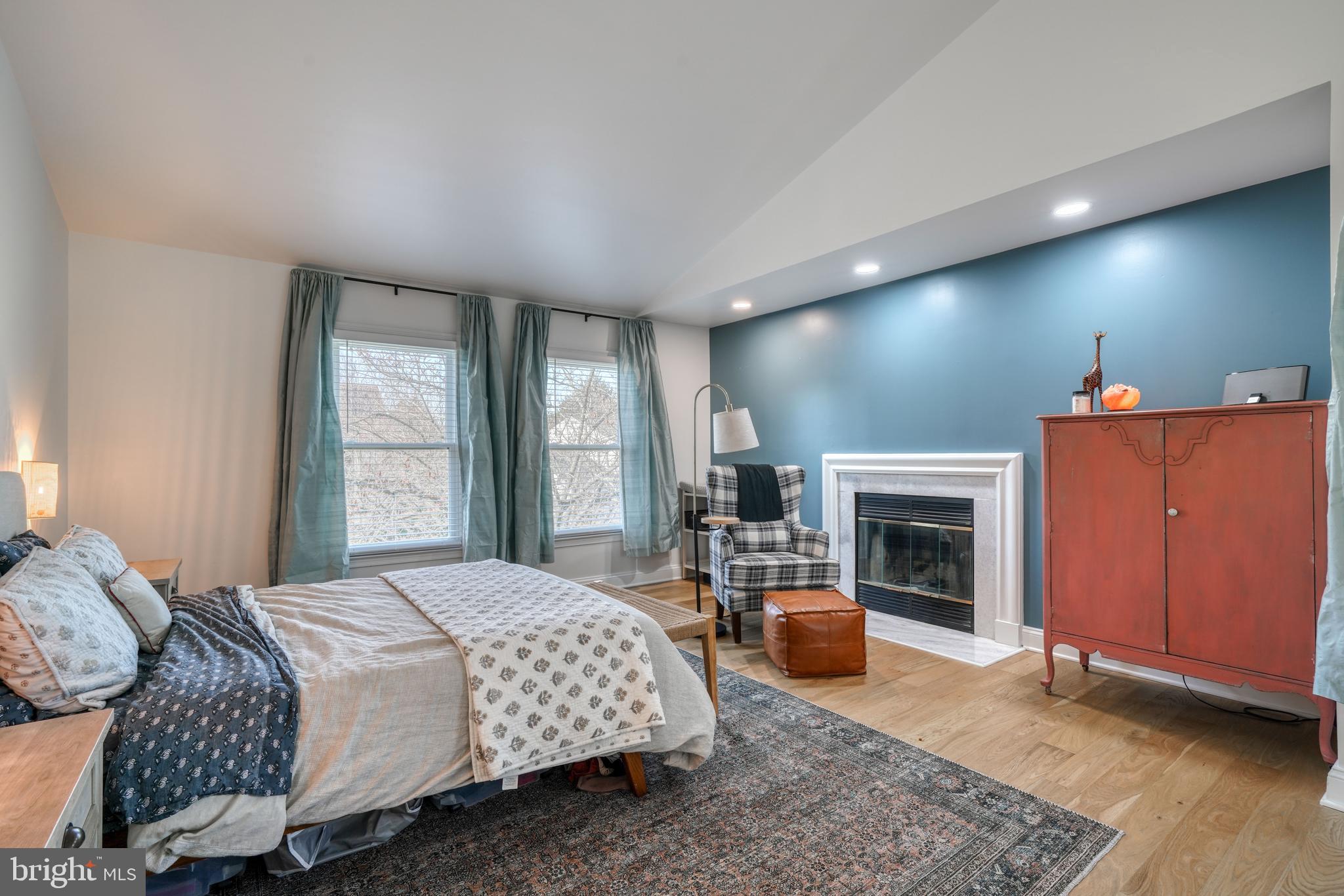 14235 Masterpiece Lane North Potomac, MD 20878 - Photo 37 of 66 a bedroom with a bed and a fireplace