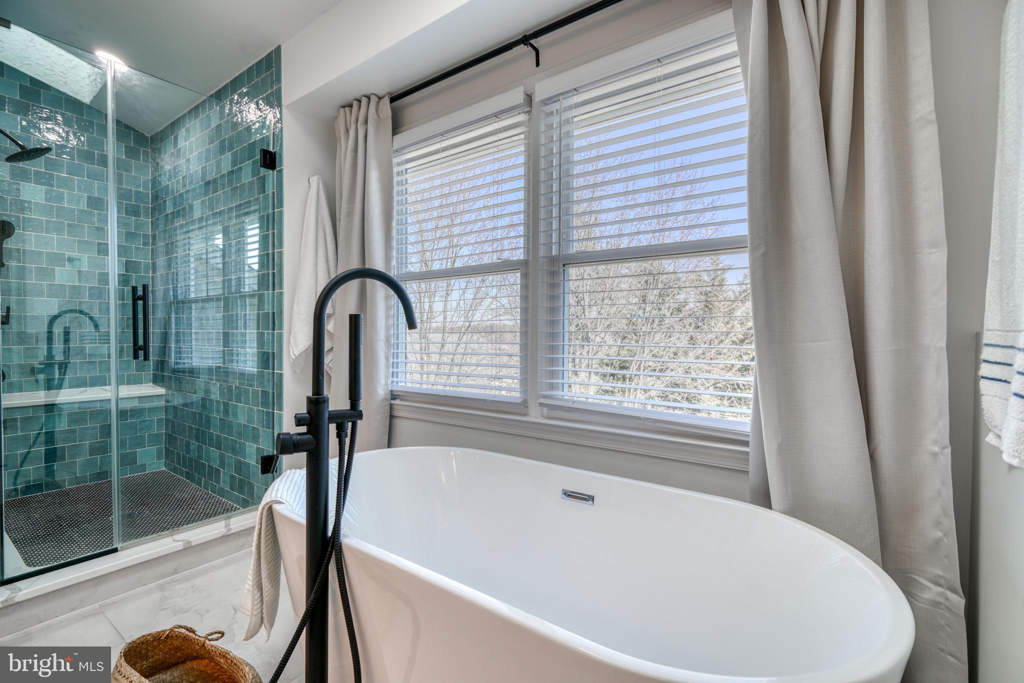 14235 Masterpiece Lane North Potomac, MD 20878 - Photo 44 of 66 a bathroom with a bathtub and shower