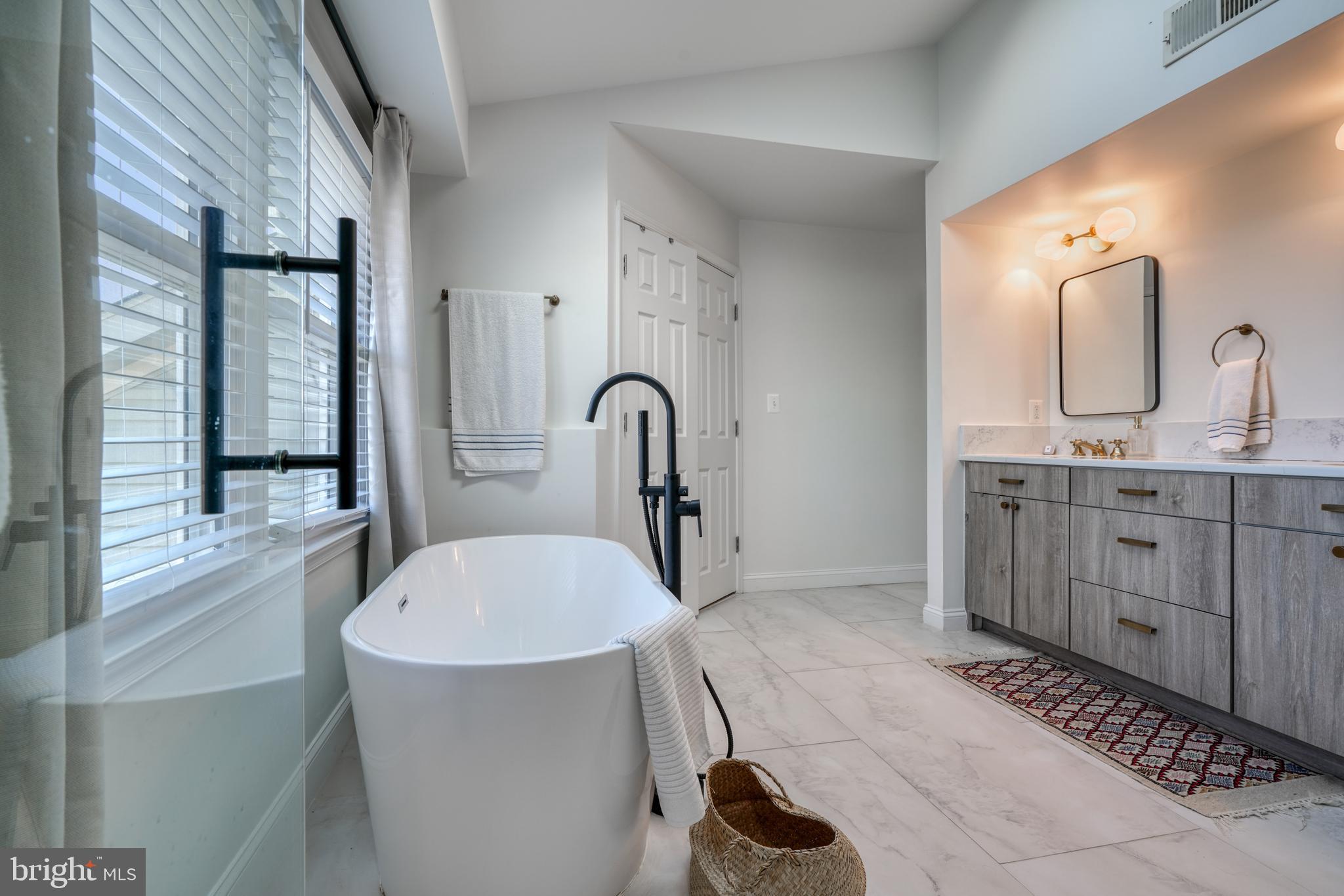 14235 Masterpiece Lane North Potomac, MD 20878 - Photo 48 of 66 a bathroom with a sink and a mirror