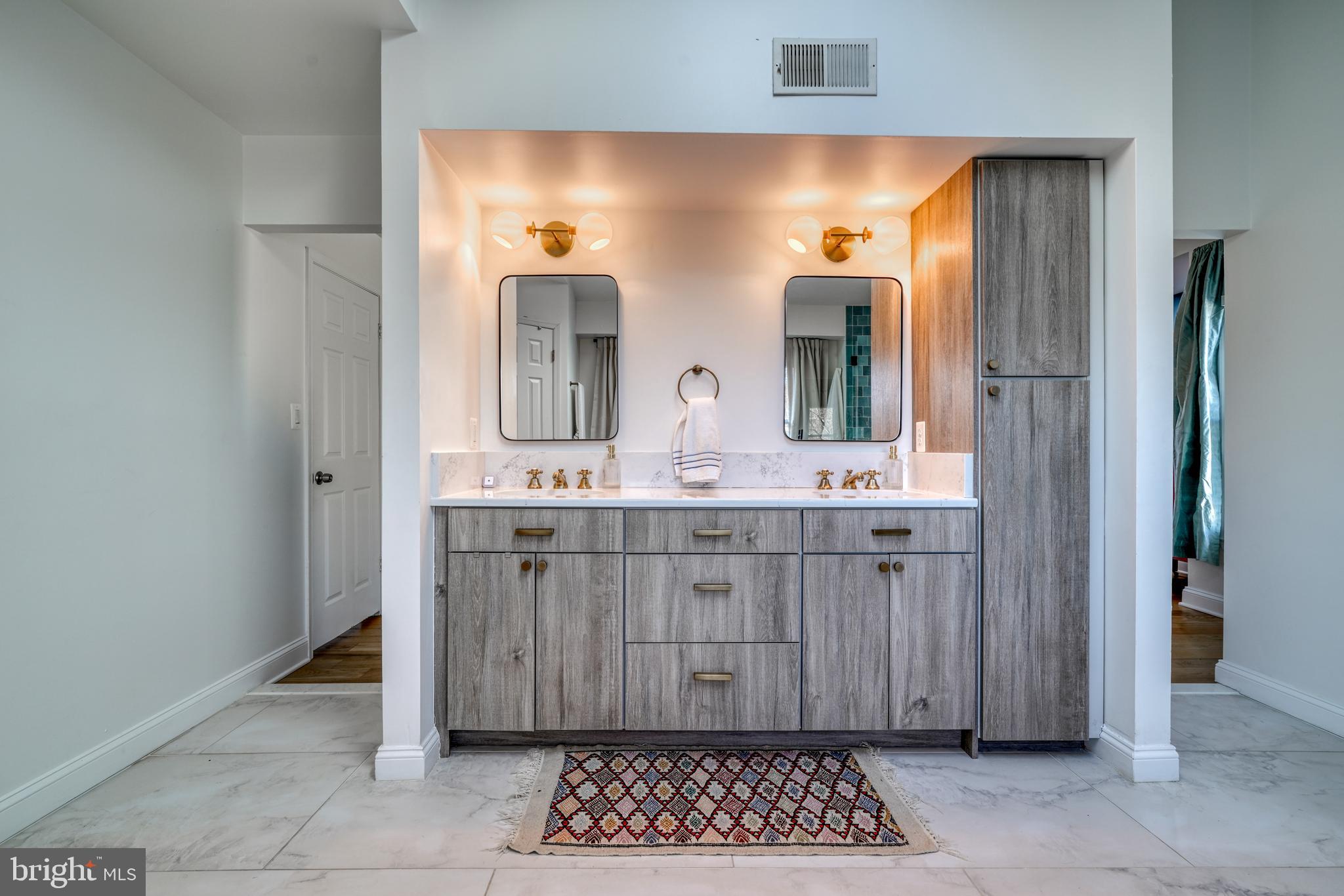 14235 Masterpiece Lane North Potomac, MD 20878 - Photo 49 of 66 a bathroom with a double vanity sink and a mirror