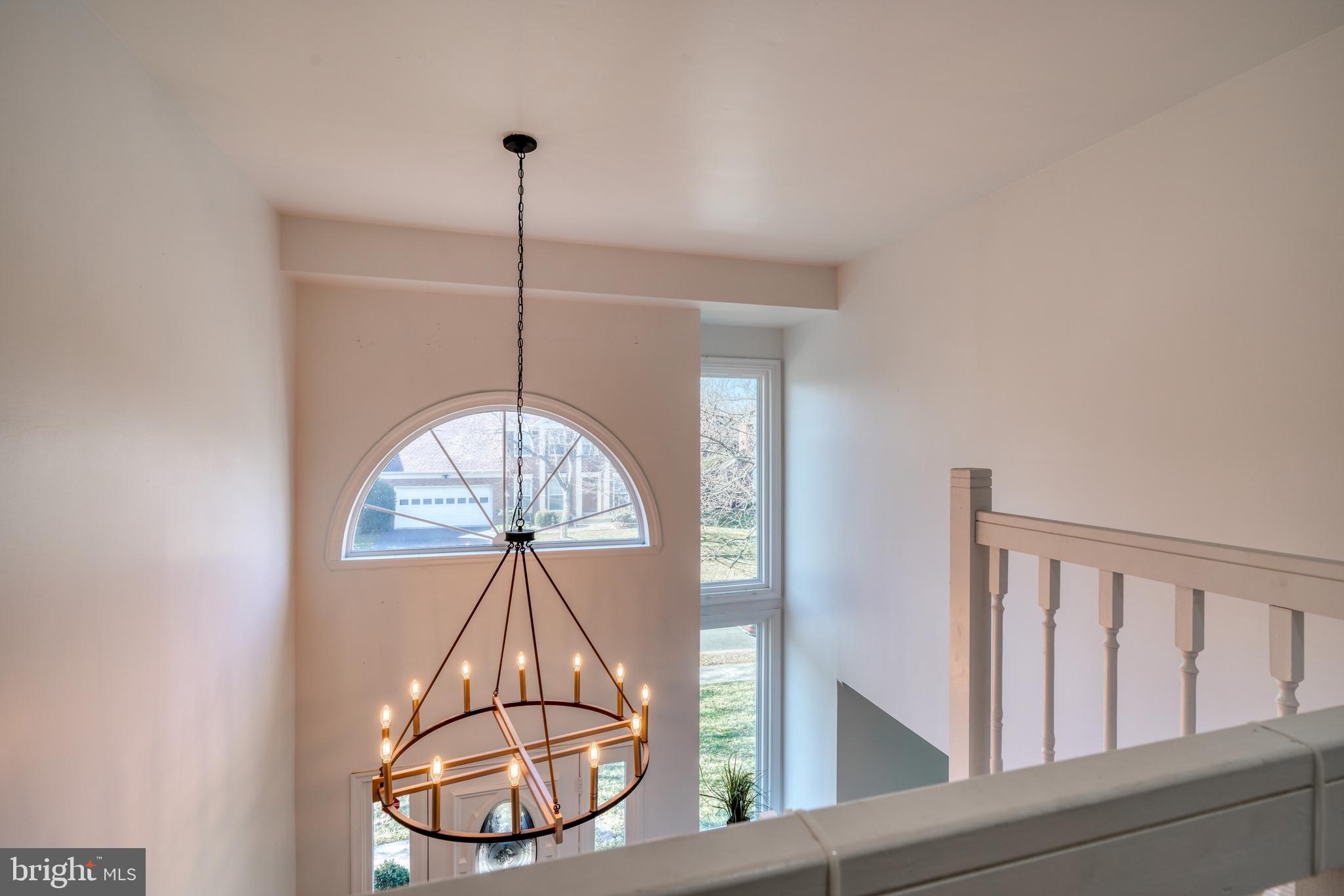 14235 Masterpiece Lane North Potomac, MD 20878 - Photo 50 of 66 a room with a chandelier fan and a window