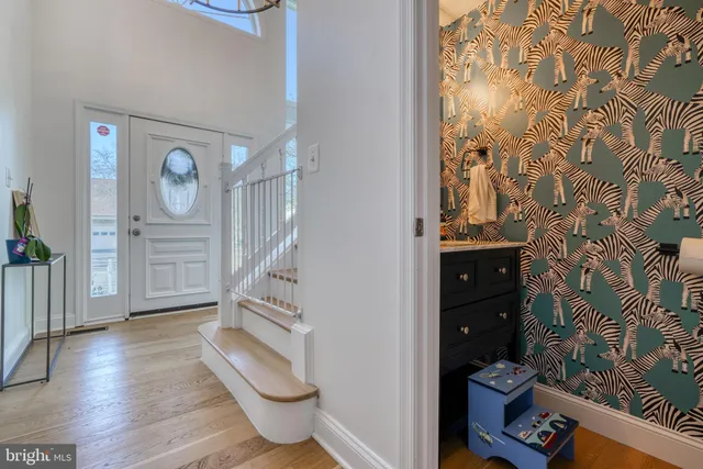 a kitchen with stainless steel appliances granite countertop a sink a stove and refrigerator