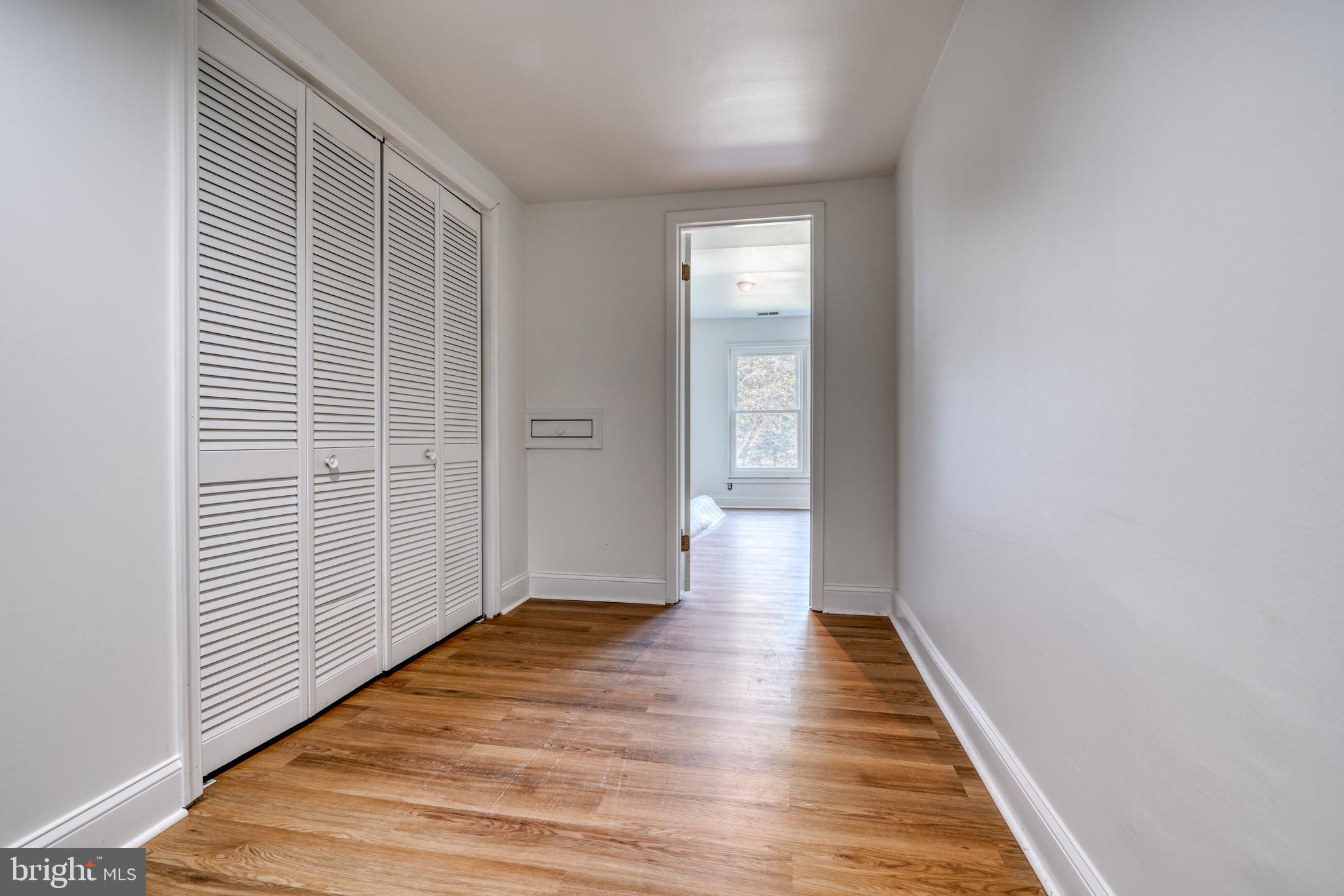 14235 Masterpiece Lane North Potomac, MD 20878 - Photo 51 of 66 a view of a hallway with wooden floor