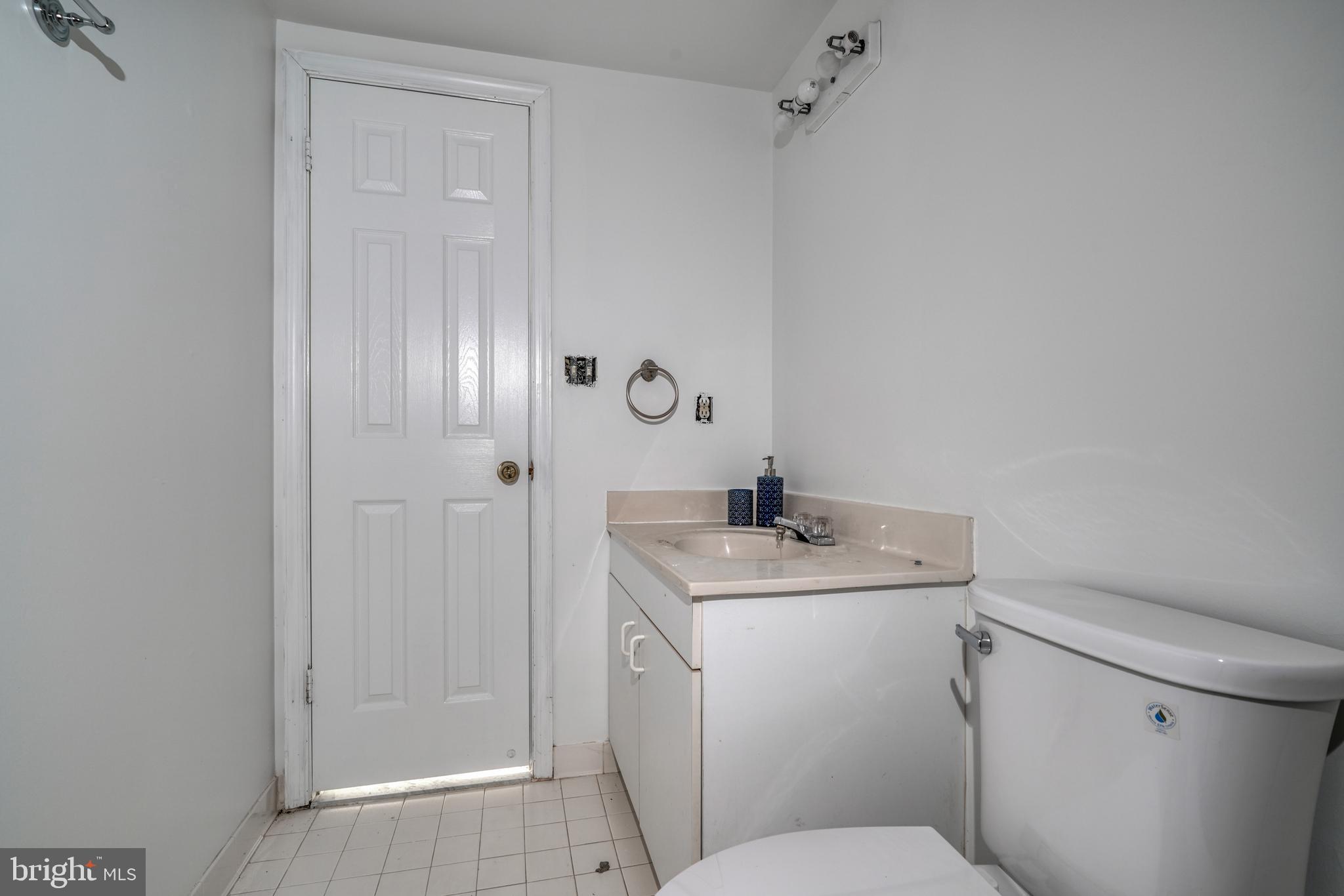 14235 Masterpiece Lane North Potomac, MD 20878 - Photo 59 of 66 a bathroom with a granite countertop sink toilet and shower