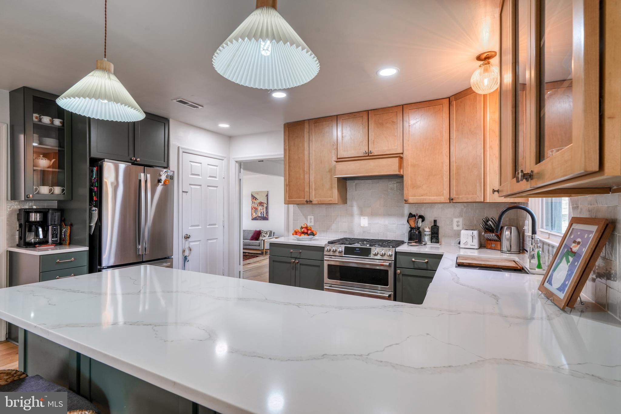 14235 Masterpiece Lane North Potomac, MD 20878 - Photo 6 of 66 a kitchen with stainless steel appliances granite countertop a sink a stove and refrigerator