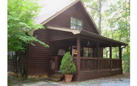 247 Moss Lane Blue Ridge, GA 30513 - Photo 1 of 1 a front view of a house with garden