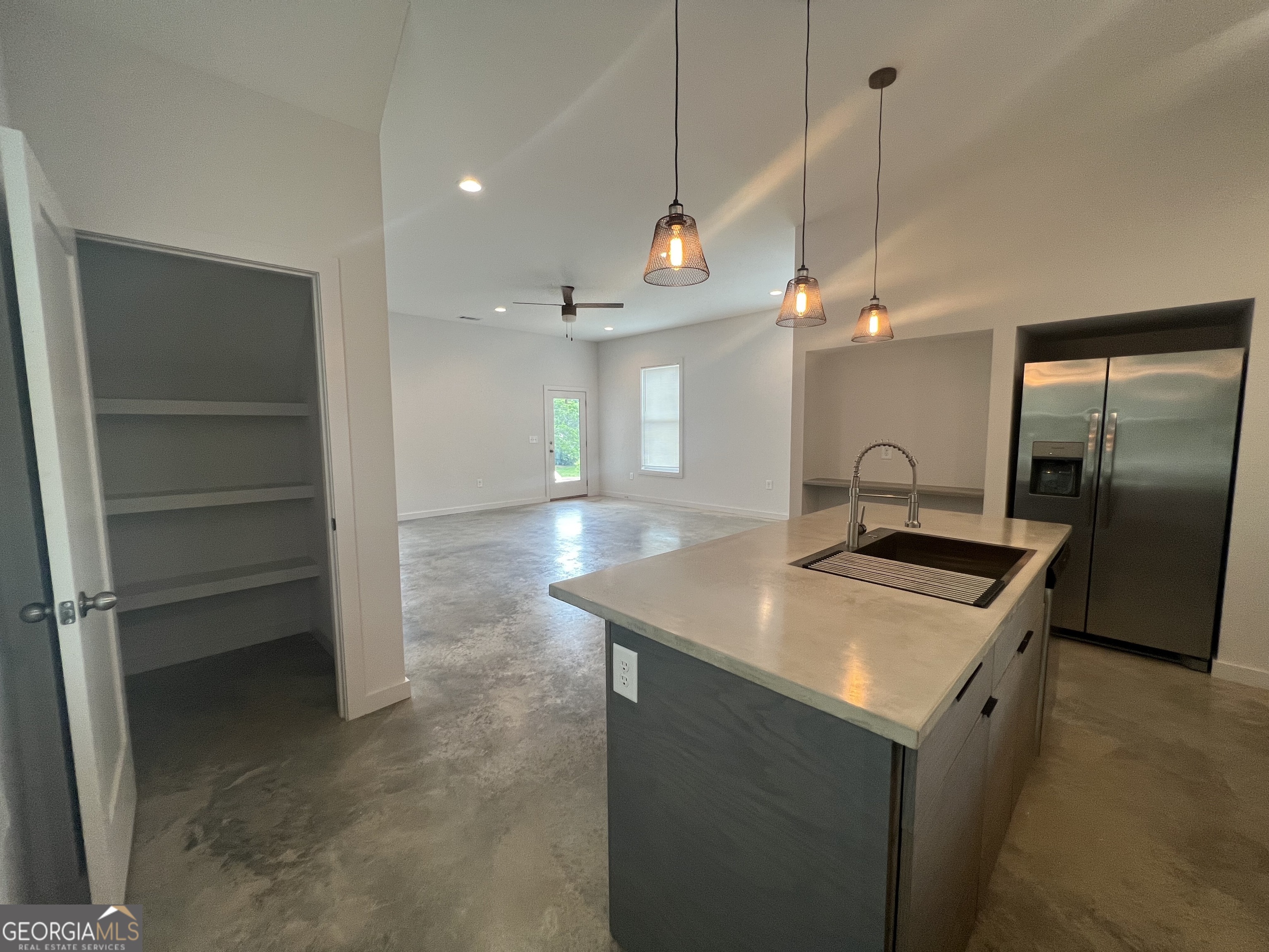 217 North Avenue Athens, GA 30601 - Photo 2 of 10 a kitchen with a stove a refrigerator a sink and chairs