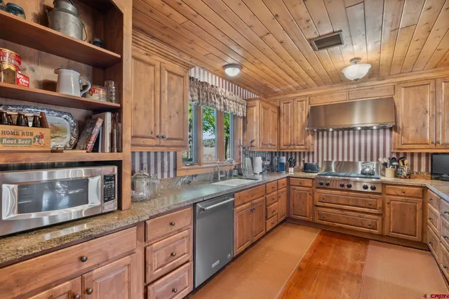 a view of a hallway with washer and dryer