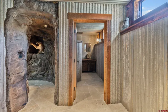 a wooden bench sitting in front of a window