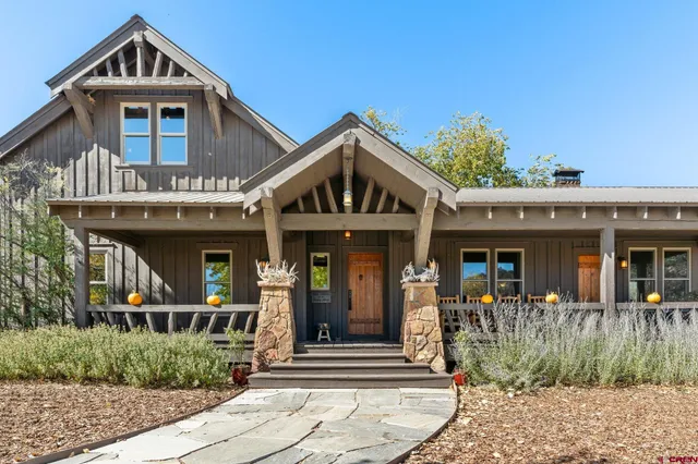 a view of house with trees in the background
