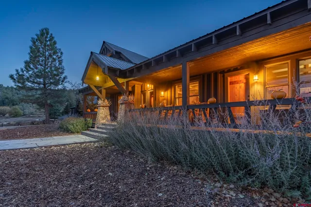 a view of a balcony with furniture and wooden floor