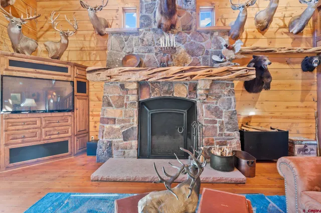 a living room with furniture a rug and a chandelier