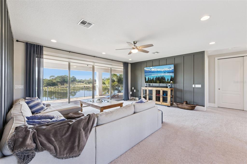 13436 Heswall Run Orlando, FL 32832 - Photo 20 of 72 a living room with furniture and large windows