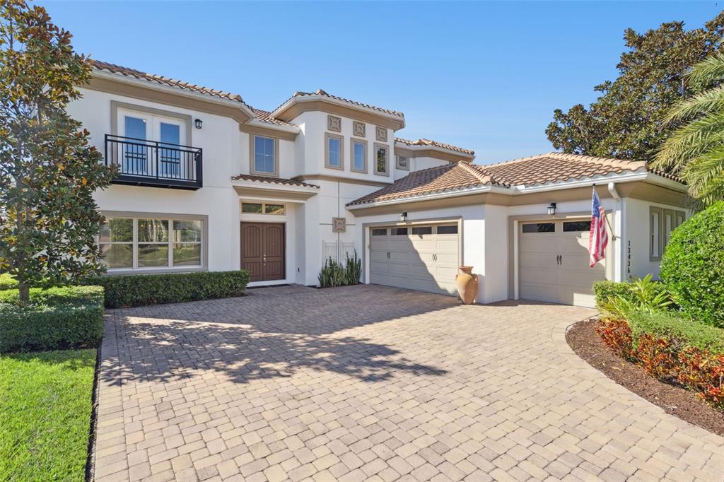 13436 Heswall Run Orlando, FL 32832 - Photo 2 of 72 a front view of a house with a garden