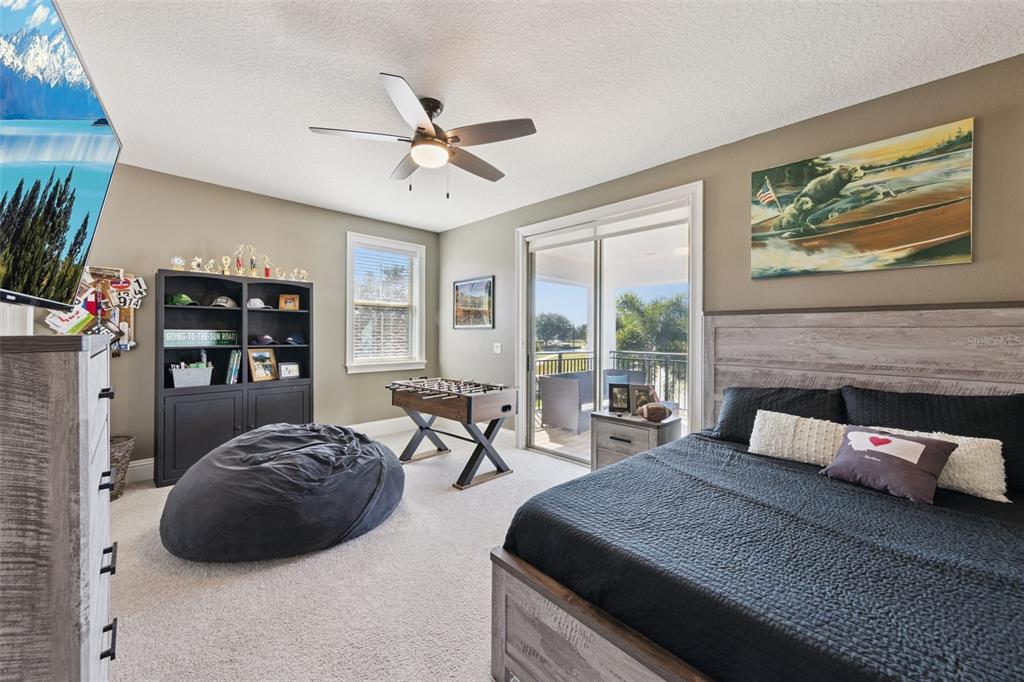 13436 Heswall Run Orlando, FL 32832 - Photo 24 of 72 a bedroom with a large bed and a window