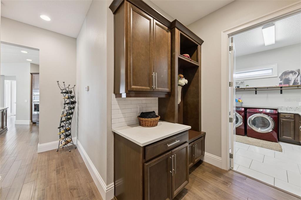 13436 Heswall Run Orlando, FL 32832 - Photo 28 of 72 a kitchen with stainless steel appliances granite countertop a refrigerator and a stove top oven