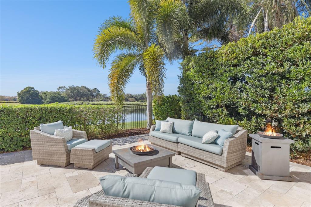 13436 Heswall Run Orlando, FL 32832 - Photo 35 of 72 a view of a patio with couches and a table and chairs with wooden fence