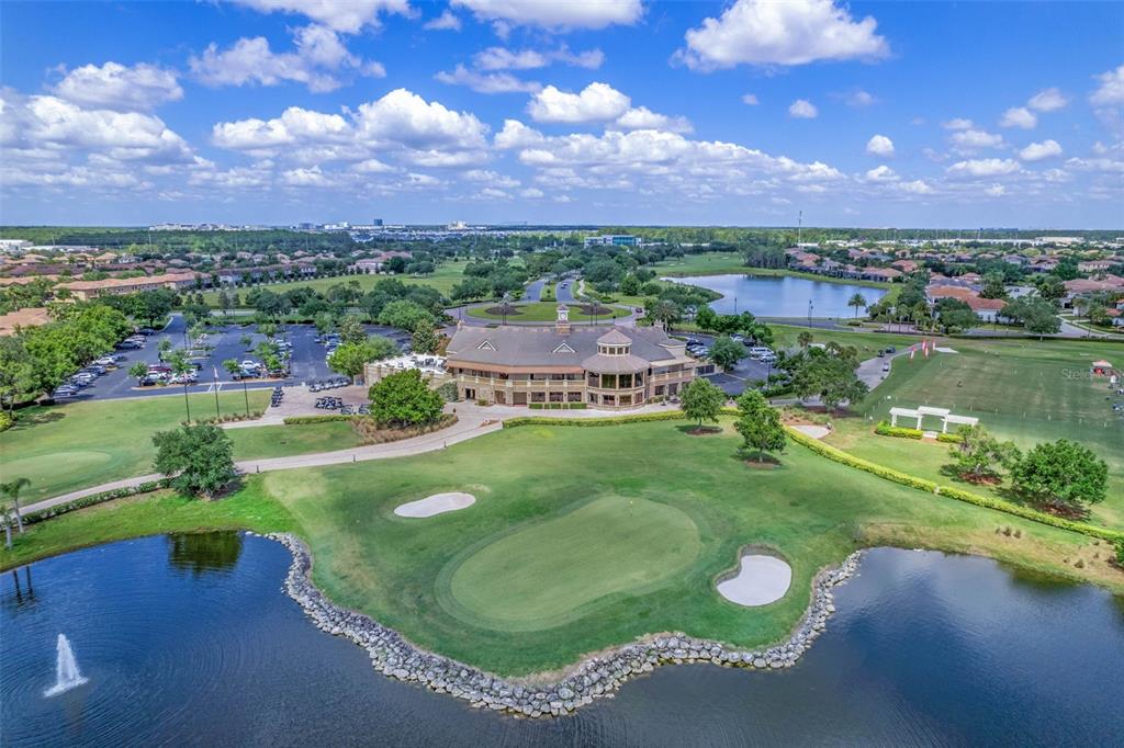 13436 Heswall Run Orlando, FL 32832 - Photo 72 of 72 a view of a lake with a building in the background