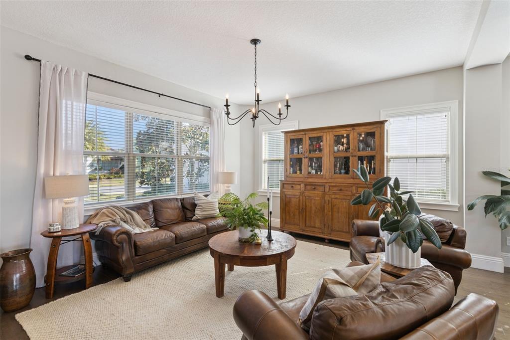13436 Heswall Run Orlando, FL 32832 - Photo 8 of 72 a living room with furniture and a large window