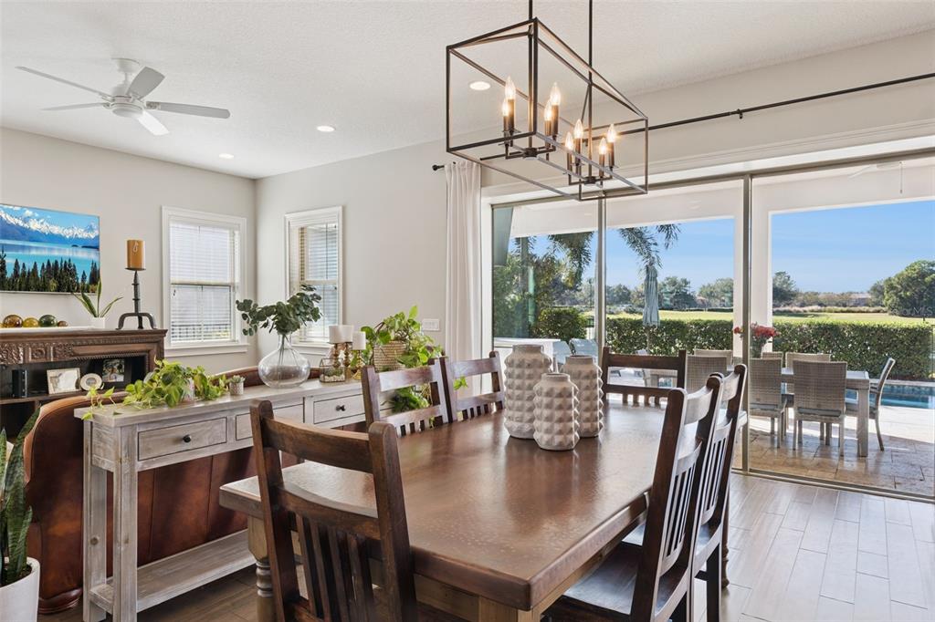 13436 Heswall Run Orlando, FL 32832 - Photo 10 of 72 a view of a dining room with furniture window and outside view