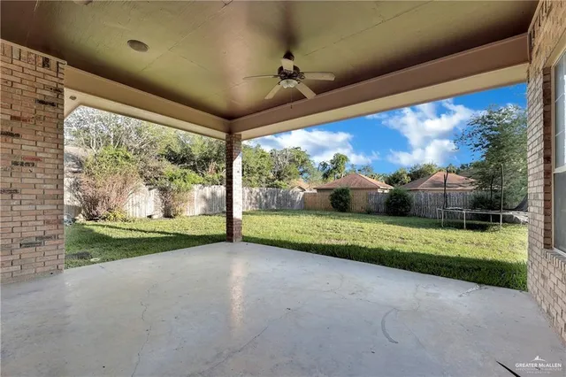 a view of a backyard of the house