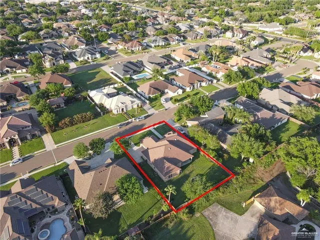 an aerial view of swimming pool patio and lake view