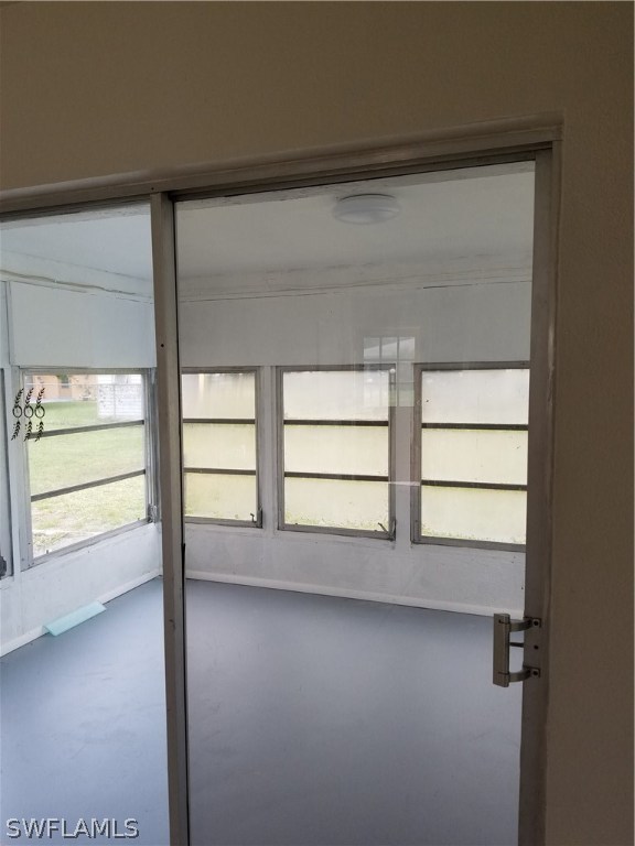 102 Texas Road Lehigh Acres, FL 33936 - Photo 4 of 6 a view of a room with window