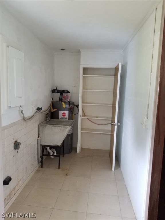 102 Texas Road Lehigh Acres, FL 33936 - Photo 6 of 6 a room with furniture and white walls