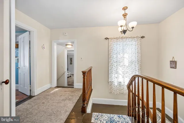 a view of a hallway view with staircase