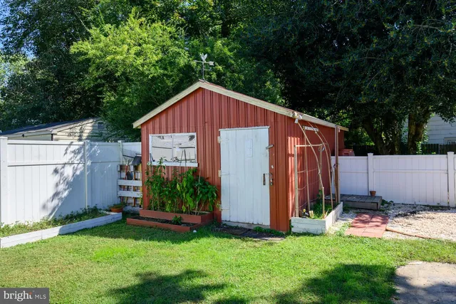 a view of backyard with tub and trees
