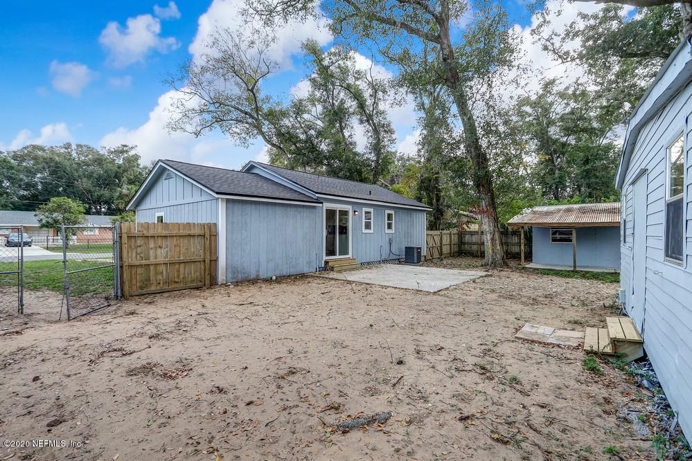 117 Hercules Road St. Augustine, FL 32086 - Photo 23 of 26 a house with trees in the background