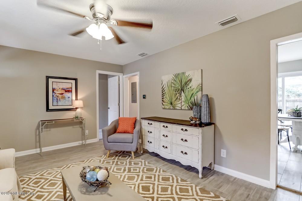 117 Hercules Road St. Augustine, FL 32086 - Photo 7 of 26 a living room with furniture and wooden floor