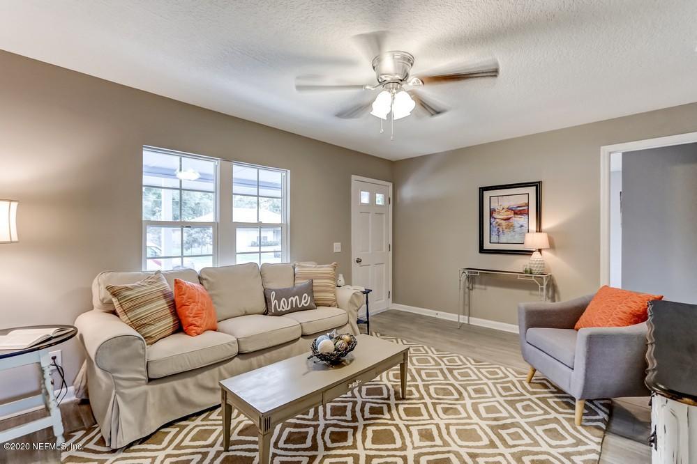 117 Hercules Road St. Augustine, FL 32086 - Photo 9 of 26 a living room with furniture and a large window