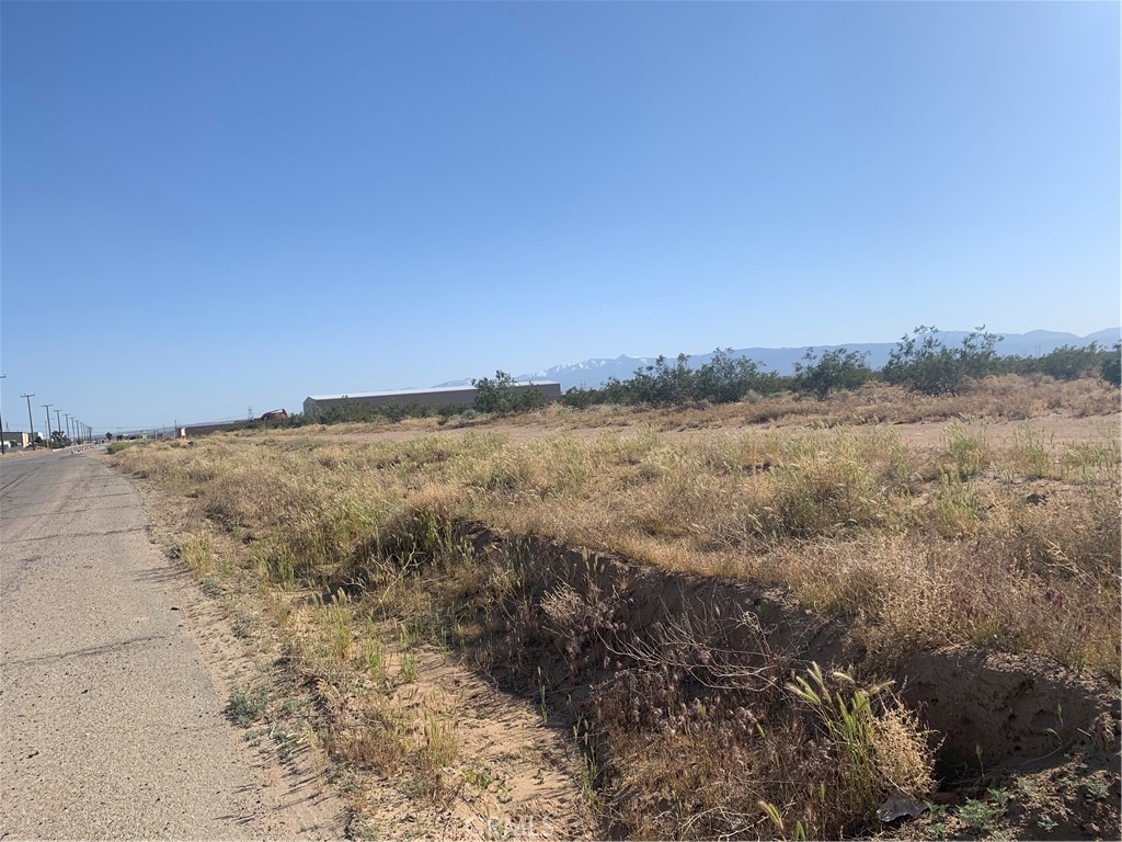 17374 Koala Road Adelanto, CA 92301 - Photo 11 of 33 a view of a field with an ocean