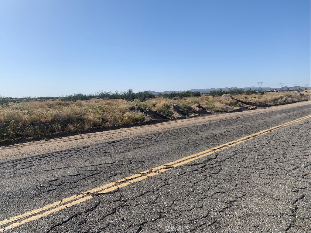 17374 Koala Road Adelanto, CA 92301 - Photo 26 of 33 a view of an ocean beach and mountain