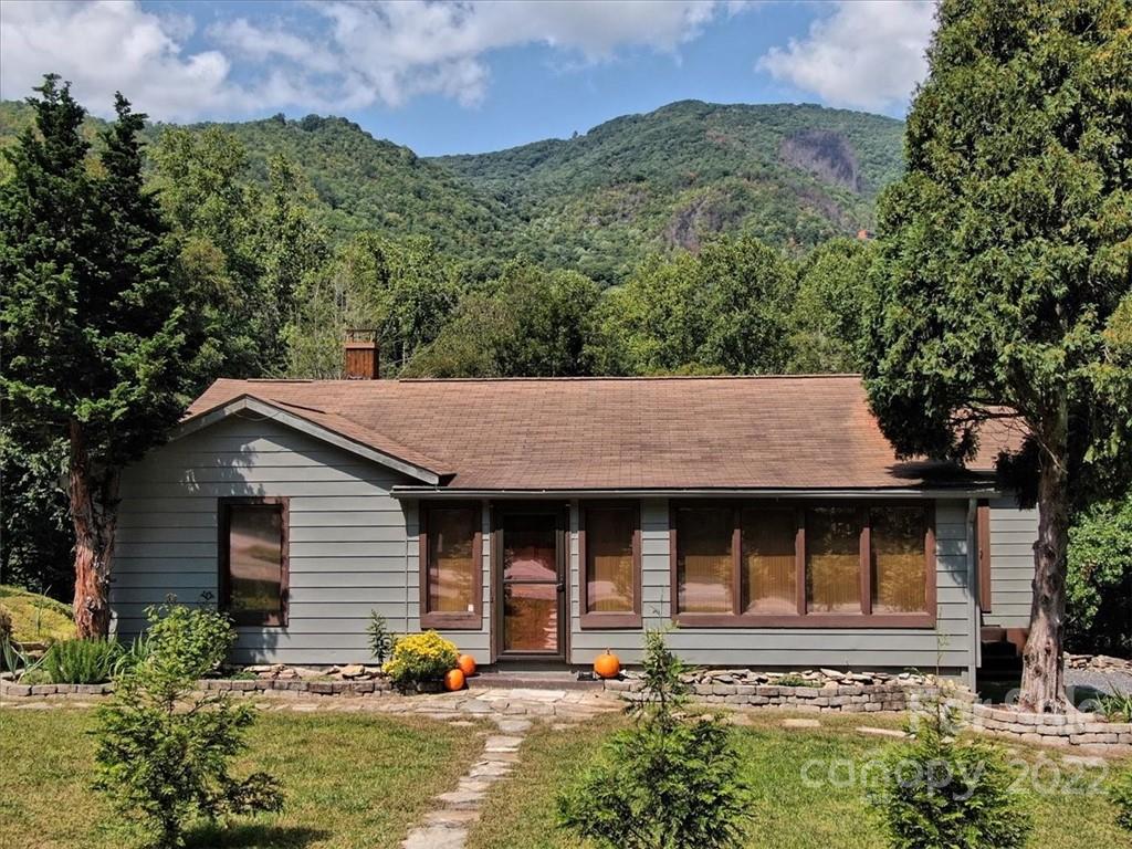 5474 Soco Road Maggie Valley, NC 28751 - Photo 1 of 48 aerial view of a house with a yard and potted plants