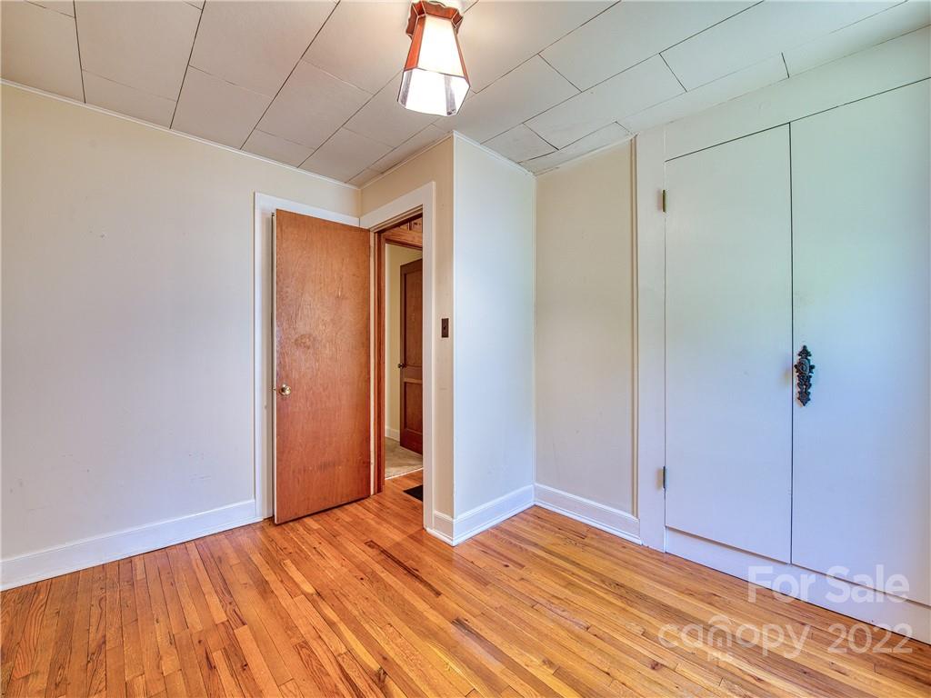 5474 Soco Road Maggie Valley, NC 28751 - Photo 19 of 48 a view of empty room with wooden floor